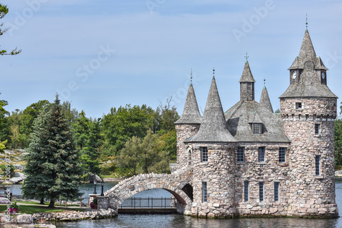 Detail of Boldt castle towers and bridge, in Heart Island. Located in the border between Canada and United States. During daytime in a blue sky. Thousands Islands. Ontario, Canada.