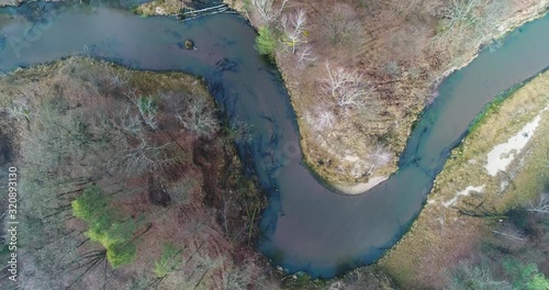 Winding Mala Panew river in winter, overhead aerial photo