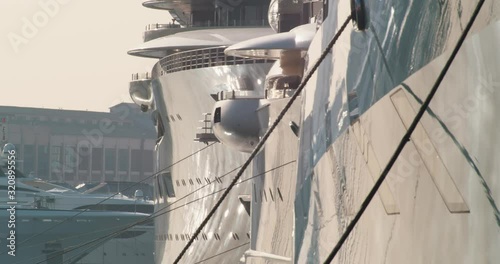 Super expensive yacht floating in the harbour of Barcelona - zoomed shot photo