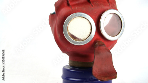 British WW2 Child’s 'Mickey Mouse’ Gas Mask and it's box. These were issued to all UK toddlers, the bright colours were designed to help turn using the mask into a game to keep the child calm 