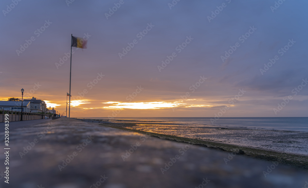 Luc-Sur-Mer, France - 08 16 2019:  View of the sea from the beach at sunset