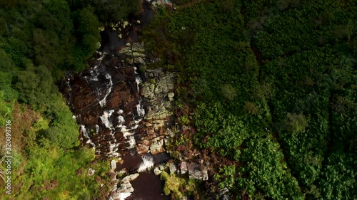 Aerial view Waterfall in Snowdonia National Park, Wales. Sunset following the footage. photo