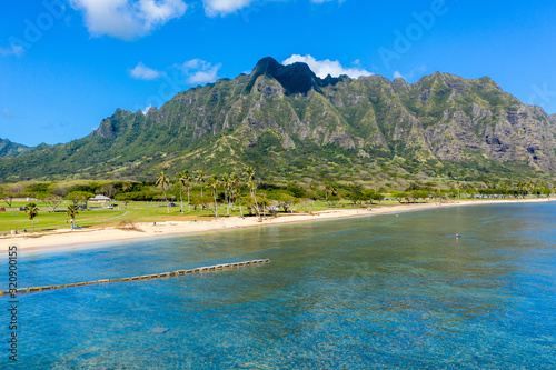 Aerial view of the beach and park at Kualoa with Ko'olau mountains in the background © steheap