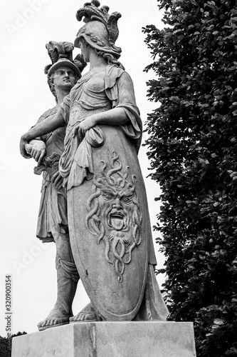 Mythological statues of 18th century. God of war Mars and goddes of peace Minerva and a big shield with the head of Medusa.