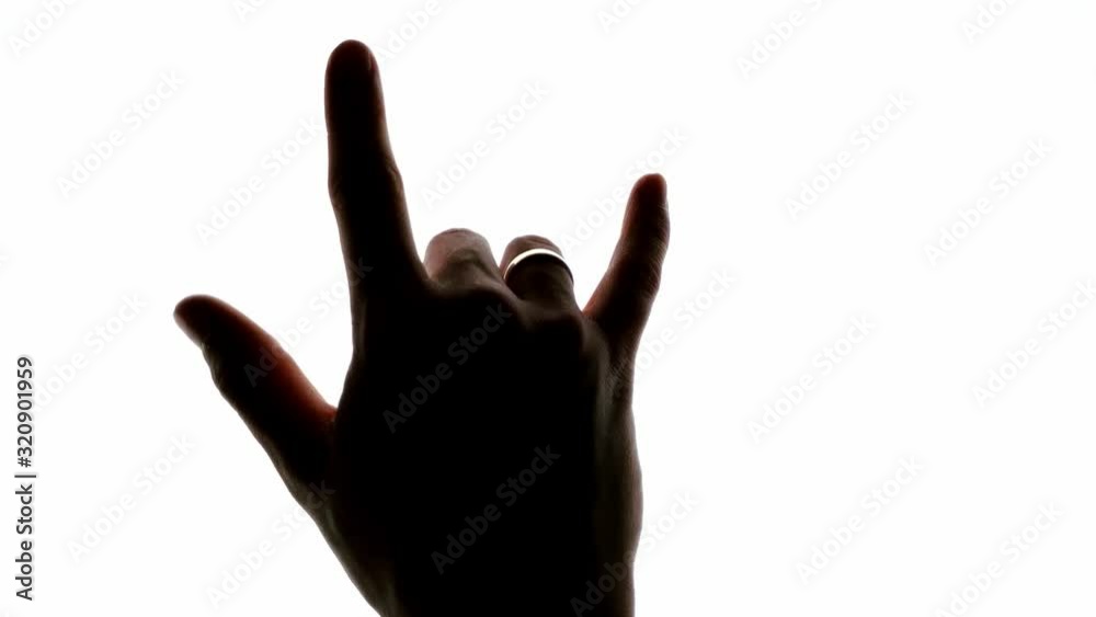 Rock and roll music devil horns hand sign on a chroma key white screen Rock and roll music devil horns hand sign on a chroma key white screen