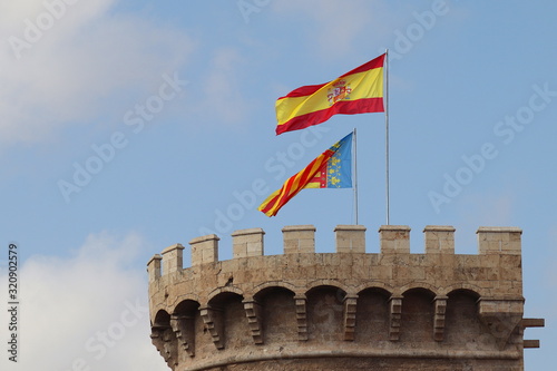Flags on Torres de Quart in Valencia, Spain