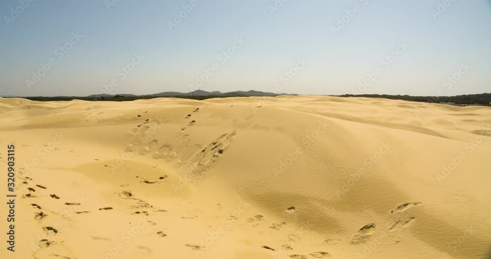 Slow zoom in on footprints in the sand dunes at Anna Bay, New South Wales, Australia Slow zoom in on footprints in the sand dunes at Anna Bay, New South Wales, Australia