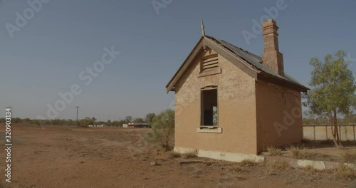 Old abandoned brick building that was part of an old railway station in the small rural town of Girilambone, Outback New South Wales photo