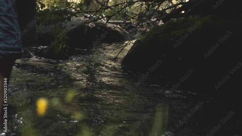 man refreshing himself in the river stream, in slow motion man refreshing himself in the river stream, in slow motion
