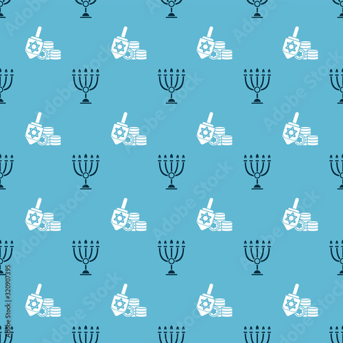Set Hanukkah menorah and Hanukkah dreidel and coin on seamless pattern. Vector