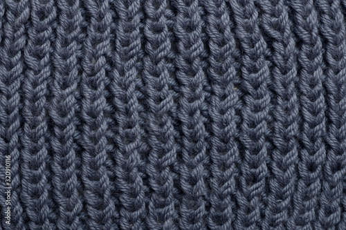  knitted gray background, texture of a knitted plaid of merino wool