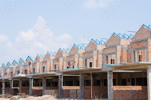 SEREMBAN, MALAYSIA -JUNE 18, 2019: New double story luxury terrace house under construction in Malaysia.  Designed by an architect with a modern and contemporary style.  photo