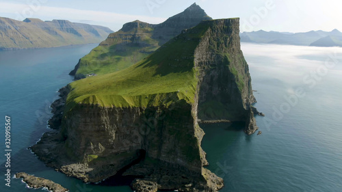 Top view of a mountain covered with grass in the sea on the Lofoten Islands