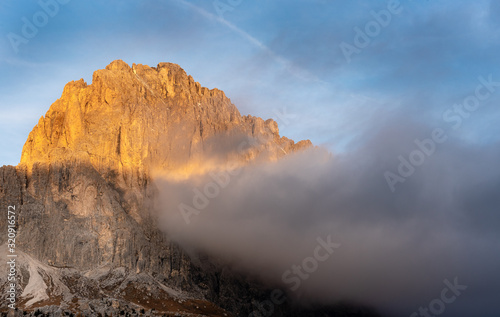 Mountain peaks of Langkofel or Saslonch, mountain range in the dolomites during sunrise in Italy