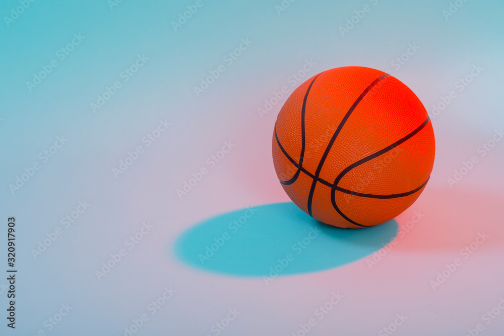 Basketball ball isolated on blue background. Blue neon Banner Art concept