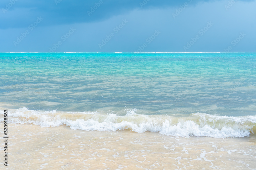 Caribbean sea coast. Blue sky with clouds and turquoise water. Travel photo, background, wallpaper. Copy space. Place for text. Yucatan. Quintana roo. Mexico.