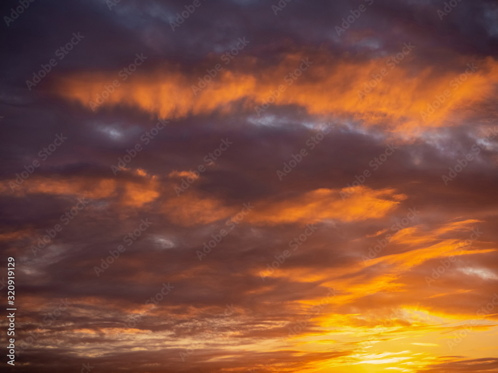 Rich colorful sunset sky. Orange and purple color. Nature background.