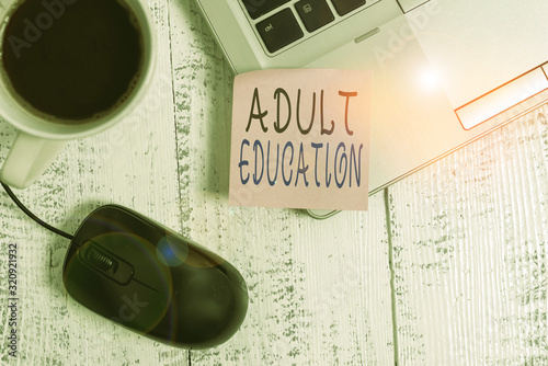 Word writing text Adult Education. Business photo showcasing educational programs for adults who are out of school Trendy metallic laptop blank sticky note coffee cup mouse lying vintage photo