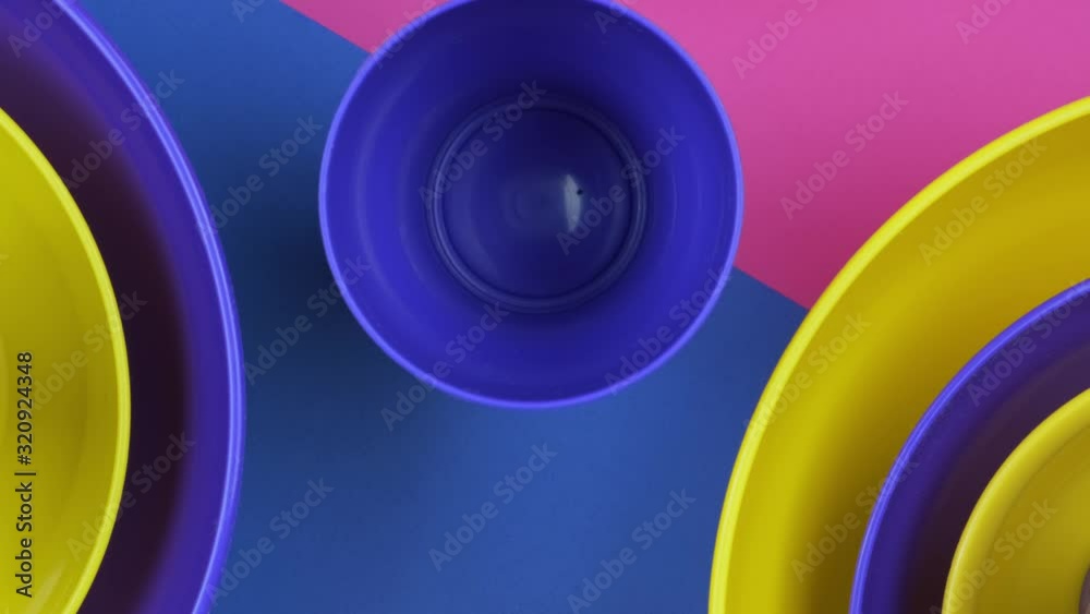 Pink blue Yellow colorful plastic water bowls futuristic color design. 4k footage Pink blue Yellow colorful plastic water bowls futuristic color design. 4k footage