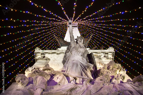 Colorful lights on a statue