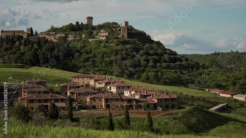 Tuscany landscape with meadows, Italian village and medieval Monticchiello town