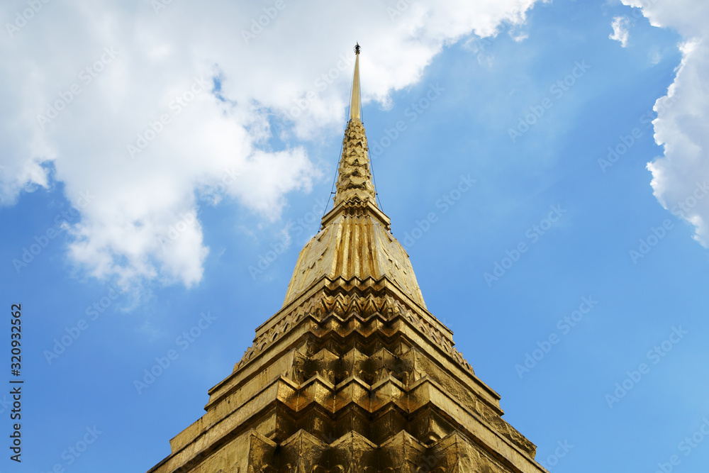 golden pagoda against blue sky