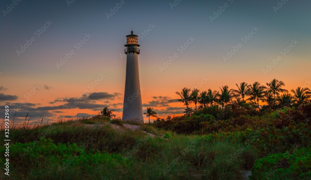 lighthouse lighthouse coast beach ocean building tower landscape florida architecture white nautical blue water landmark