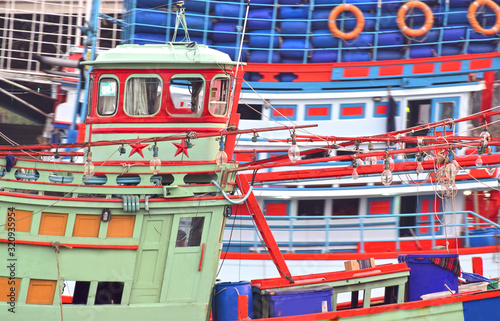  ship Is a fishing boat The park is located on many shores and boats are about to go out for fishing.