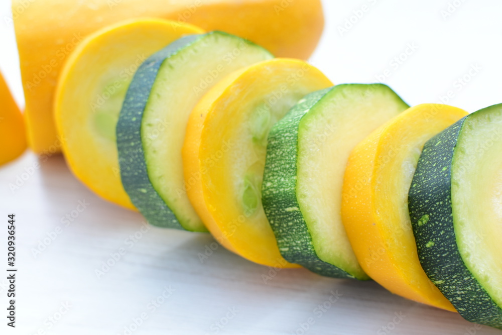 Natural, whole and chopped yellow zucchini
