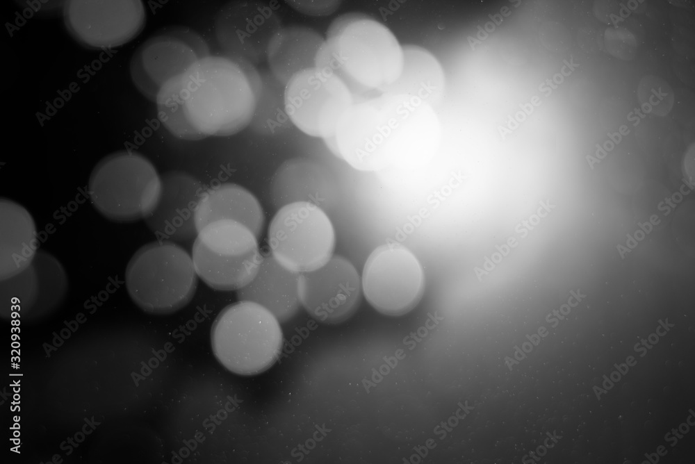 Abstract white bokeh on a black background Abstract white bokeh on a black background