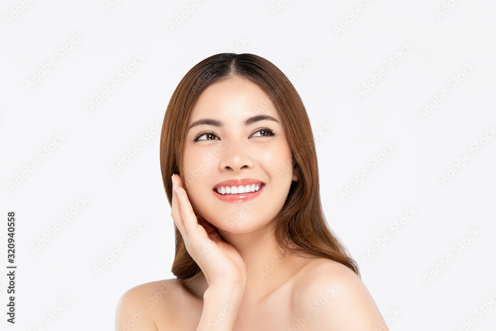 Smiling Asian woman with fair skin hand touching her face Smiling Asian woman with fair skin hand touching her face