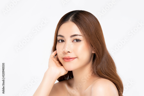 Beautiful Asian woman with fair skin doing hand on face pose