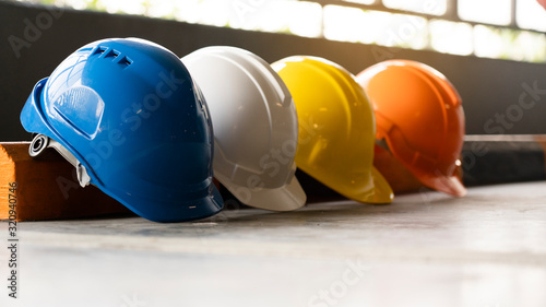 Safety Construction Worker Hats Blue, white, yellow, orange. Teamwork of construction team must have quality. Whether it engineer, construction workers. Have a helmet to wear at work. Safety at work. photo