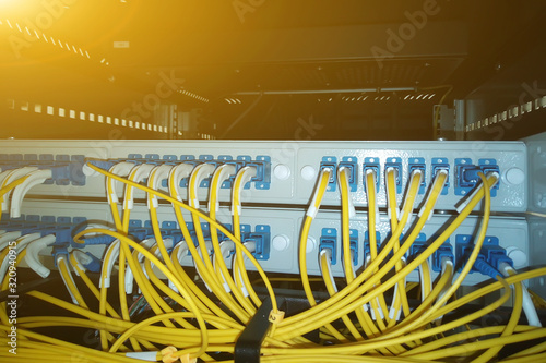cable of information network in the switchboard. yellow patch cords.