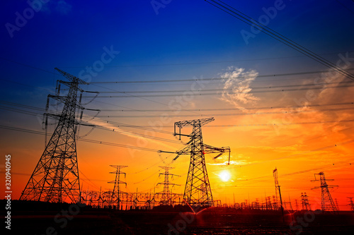 Electric tower, silhouette at sunset