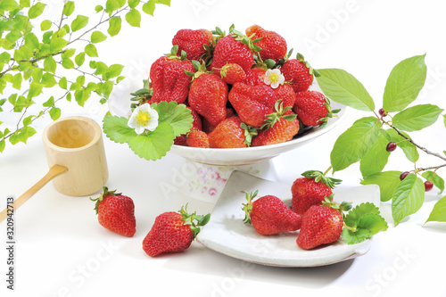 Strawberry white plate and bowl at the white background