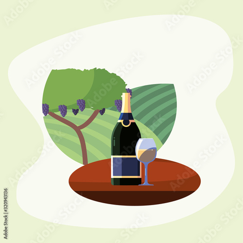 Wine bottle and cup in front of grapes tree vector design