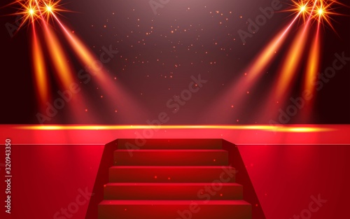 red stage and gold spotlight in the hall