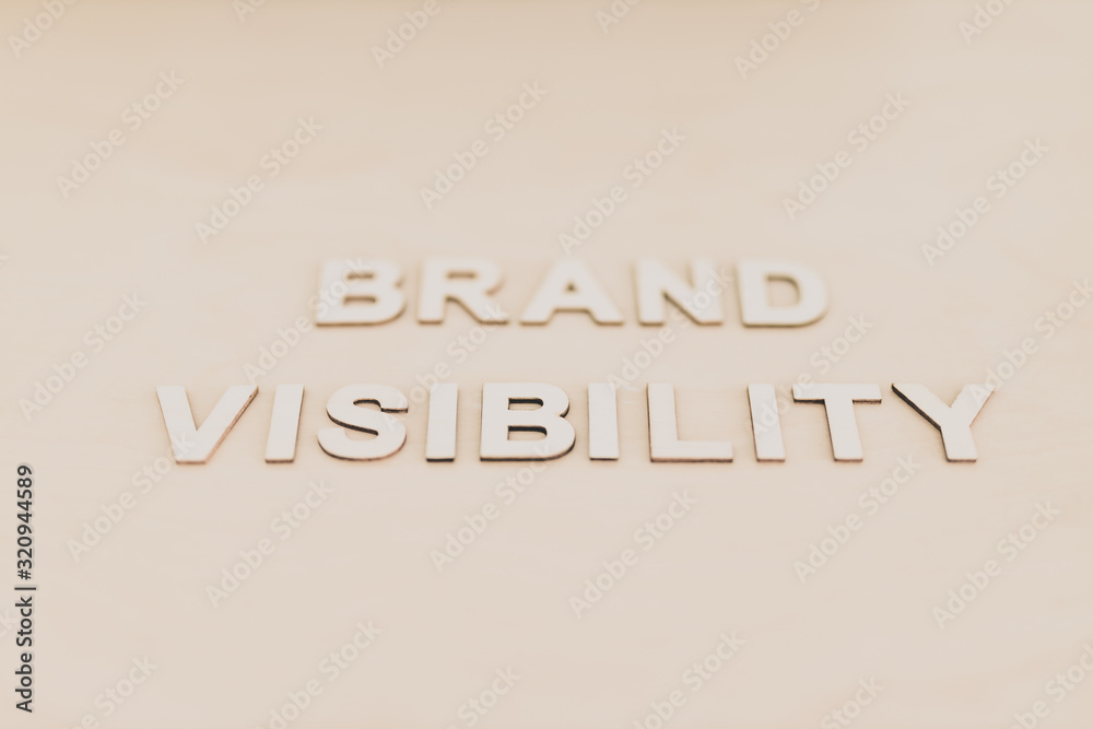 Brand Visibility message on desk with shallow depth of field and monotone editing, concept of building a successful business Brand Visibility message on desk with shallow depth of field and monotone editing, concept of building a successful business