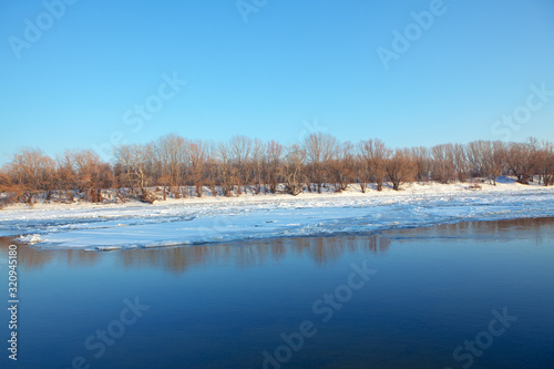 scenery with ice on the river shore in the spring season 