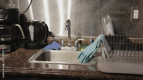 Clean And Dry Kitchen With Appliances And Accessories Placed Neatly On The Countertop - Medium Shot photo