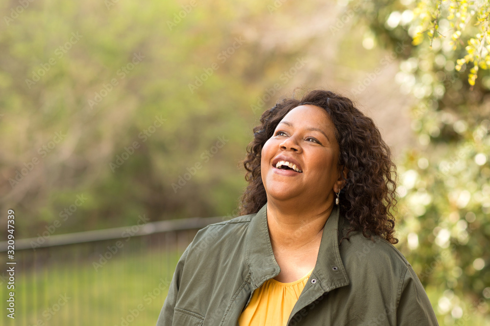 Beautiful mature African American woman smiling and laughing. Beautiful mature African American woman smiling and laughing.