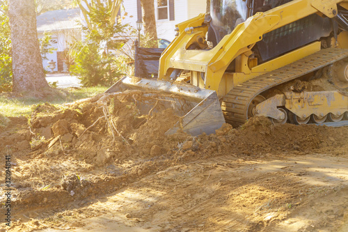 Foto Close up of bulldozer scoop moving earth landscaping works