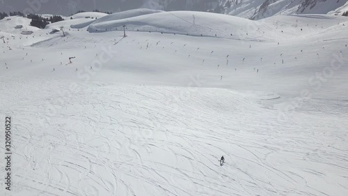 Aerial Flight over a beautiful ski area with lifts photo