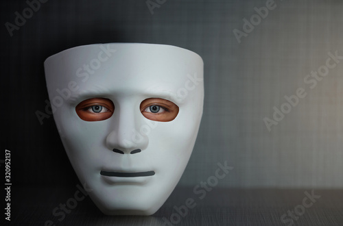 white plastic face mask with human eye