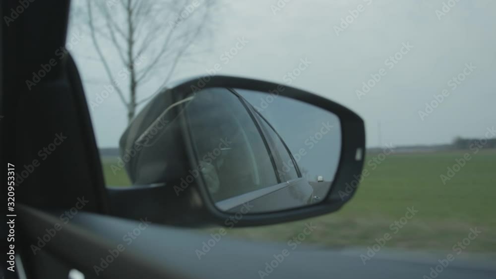 High speed side mirror view, camera shaking, different focus points High speed side mirror view, camera shaking, different focus points