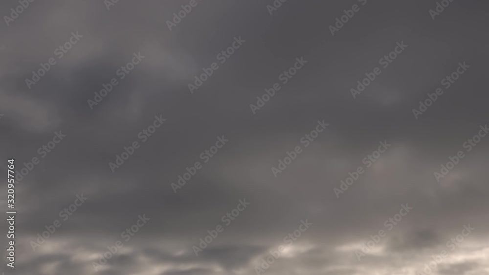 Grey Sky Timelapse of Clouds in Distance just before Storm Weather at Sunset Grey Sky Timelapse of Clouds in Distance just before Storm Weather at Sunset