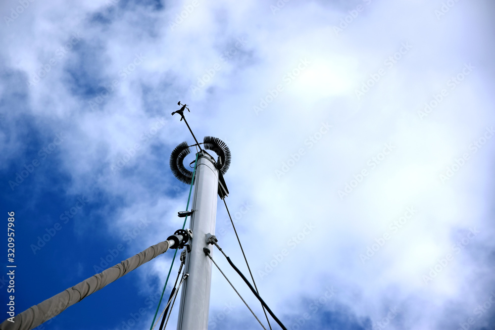 Sailing yachts masts in the sky in marina harbour