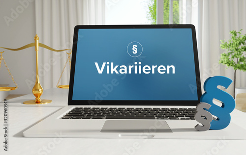 Vikariieren – Recht, Gesetz, Internet. Laptop im Büro mit Begriff auf dem Monitor. Paragraf und Waage. .