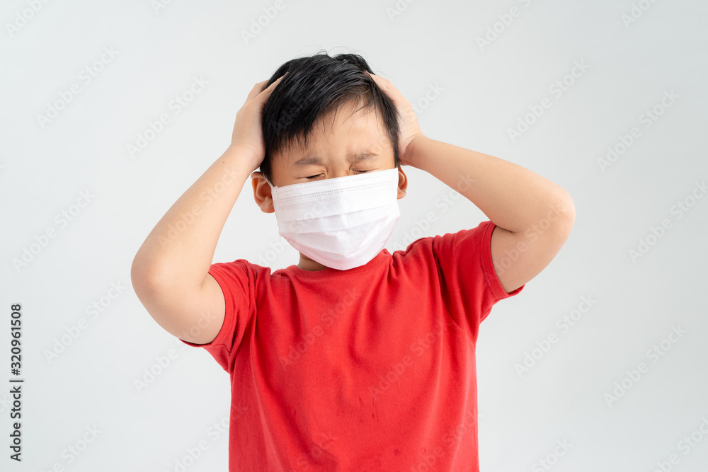 Studio portrait of little boy who have headache, wearing medical flu mask Studio portrait of little boy who have headache, wearing medical flu mask